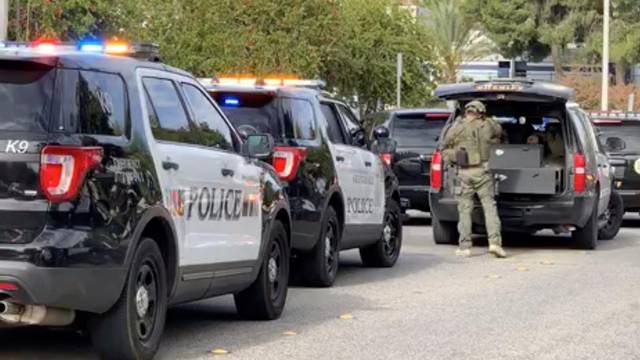 Sheriff puts on tactical gear after a shooting at Saugus High School in Santa Clarita, California