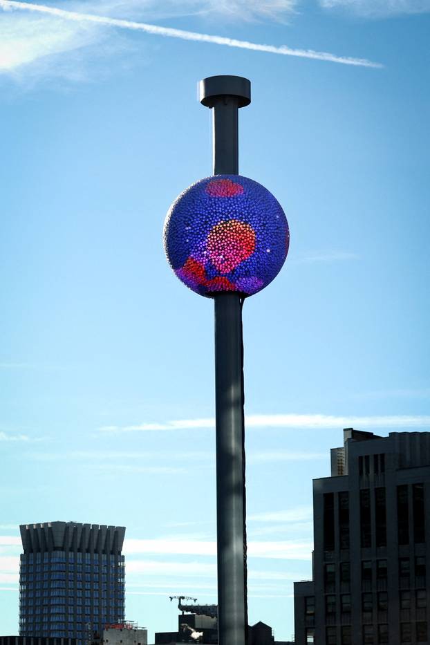 A newly created New Year's eve ball adorned with 5,280 Waterford crystals is raised for the first time above One Times Square ahead of the New Year's Eve ball drop in New York City
