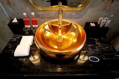 FILE PHOTO: A gold-plated bathroom sink is seen in the newly inaugurated Dolce Hanoi Golden Lake luxury hotel, after the government eased a nationwide lockdown following the global outbreak of the coronavirus disease (COVID-19), in Hanoi, Vietnam