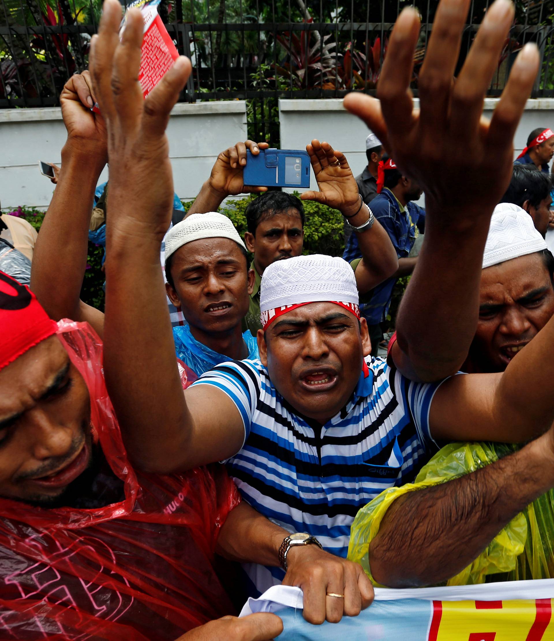 Rohingyas living in Malaysia protest against the treatment of Myanmar's Rohingya Muslims near the Myanmar embassy in Kuala Lumpur