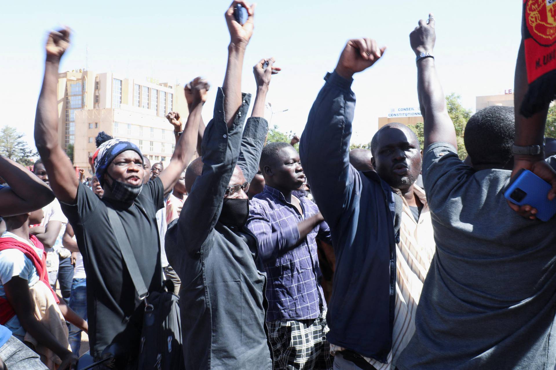 People show their support for the military after Burkina Faso President Roch Kabore was detained at a military camp in Ouagadougou