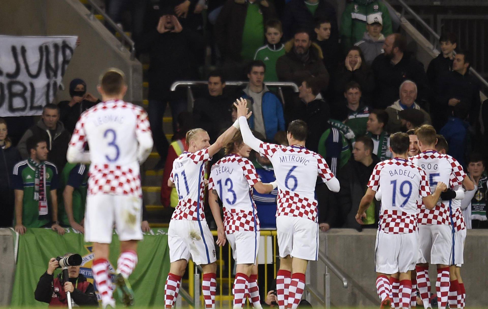 Croatia's Duje Cop celebrates scoring their second goal with teammates