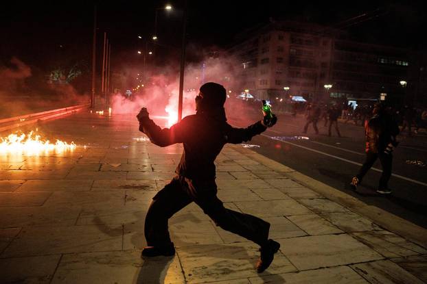 Protesters clash with police during a demonstration after a train crash near the city of Larissa, in Athens