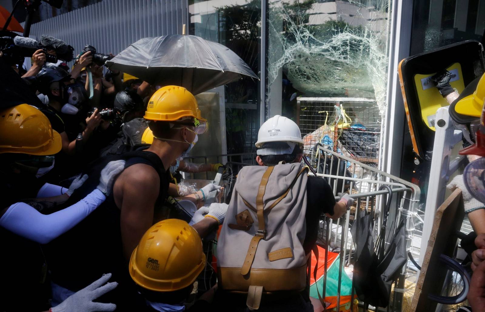 Protesters try to break into the Legislative Council building during the anniversary of Hong Kong's handover to China in Hong Kong