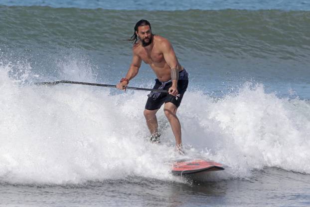EXCLUSIVE: Aquaman star Jason Momoa shows off his ripped body as he hits the surf in Hawaii