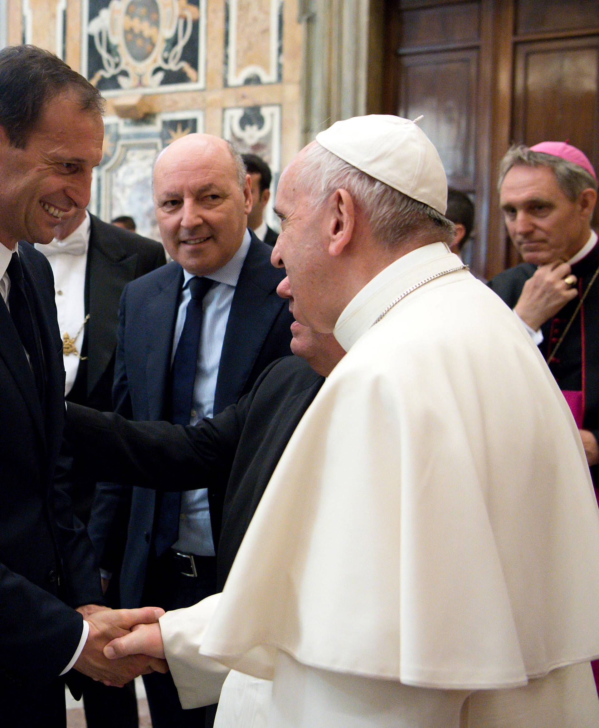 Juventus coach Allegri shakes hands with Pope Francis during a private audience at the Vatican