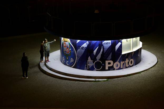 People take a selfie in the vicinity of the the Dragao Stadium as thousands of English fans make their way to Portugal