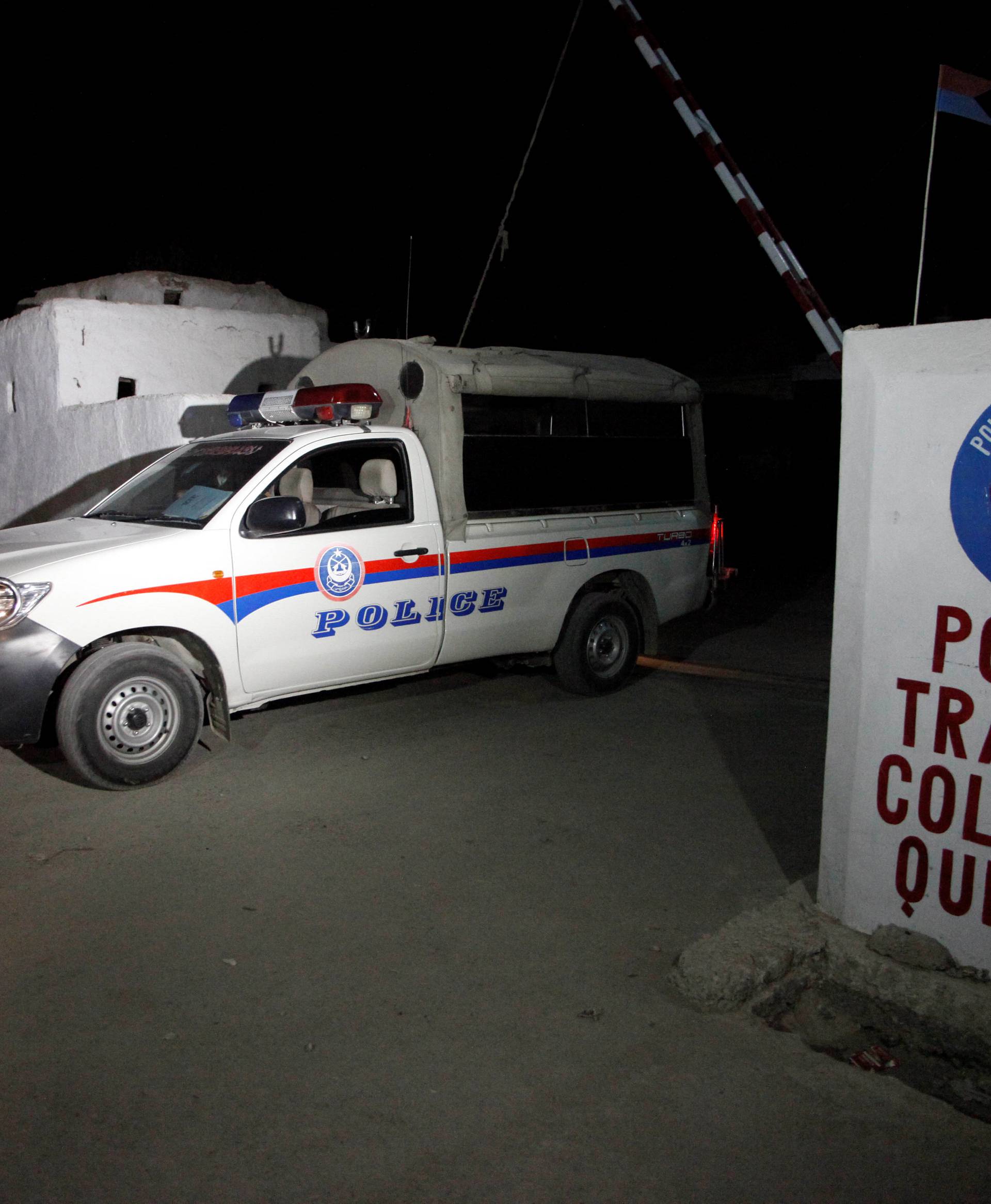 A police truck is seen at a gate to the Police Training Center after an attack on the center in Quetta