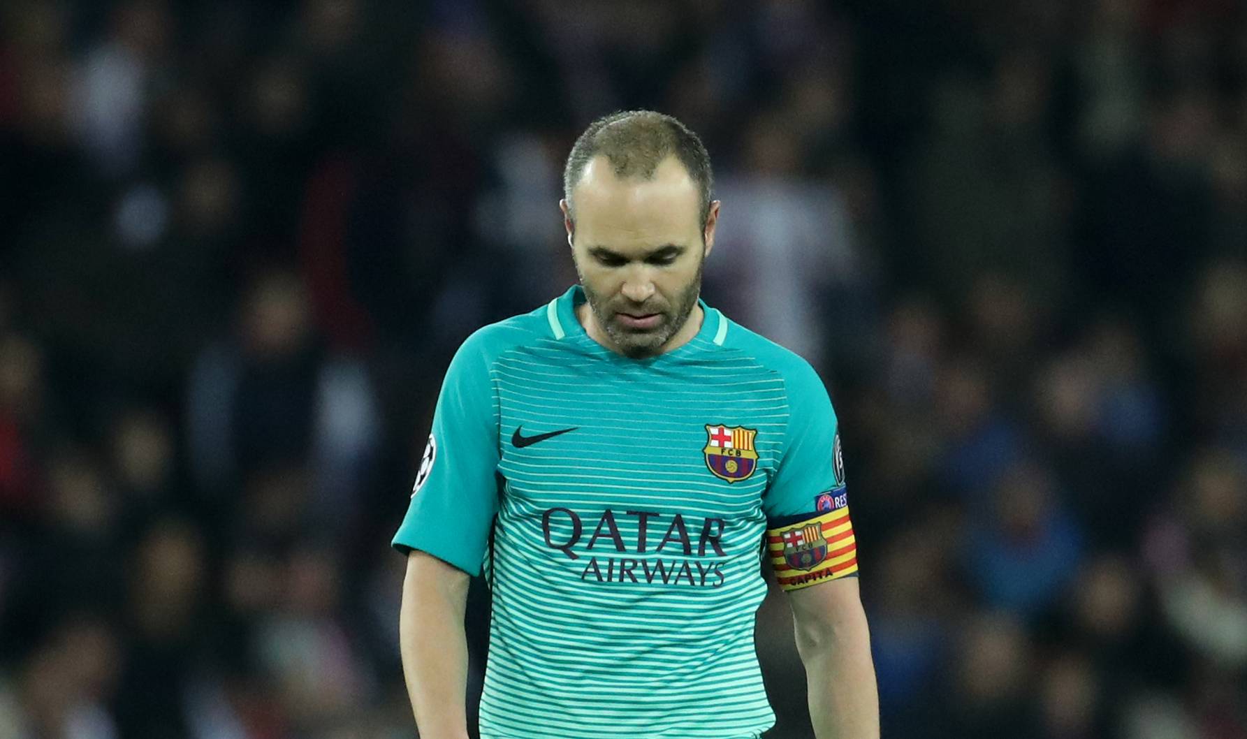 Barcelona's Andres Iniesta looks dejected