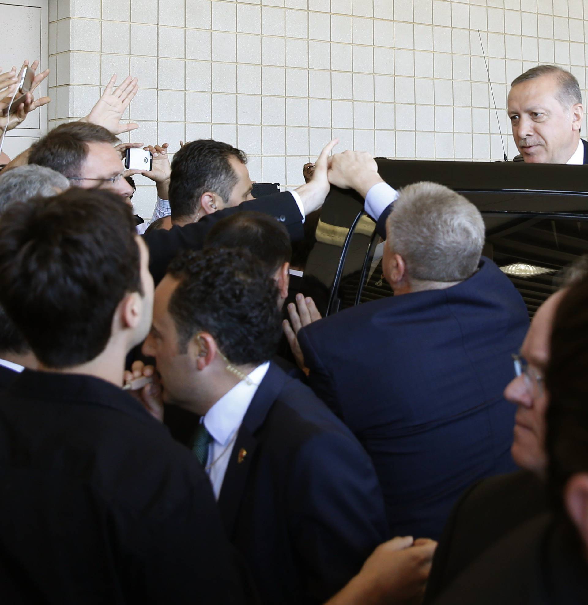 Turkish President Tayyip Erdogan departs after the jenazah Islamic funeral prayer for the late boxing champion Muhammad Ali in Louisville