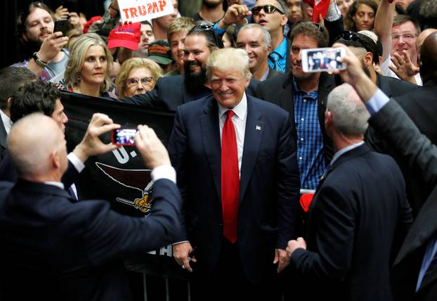 Republican U.S. presidential candidate Donald Trump signs autographs after a rally with supporters in San Diego