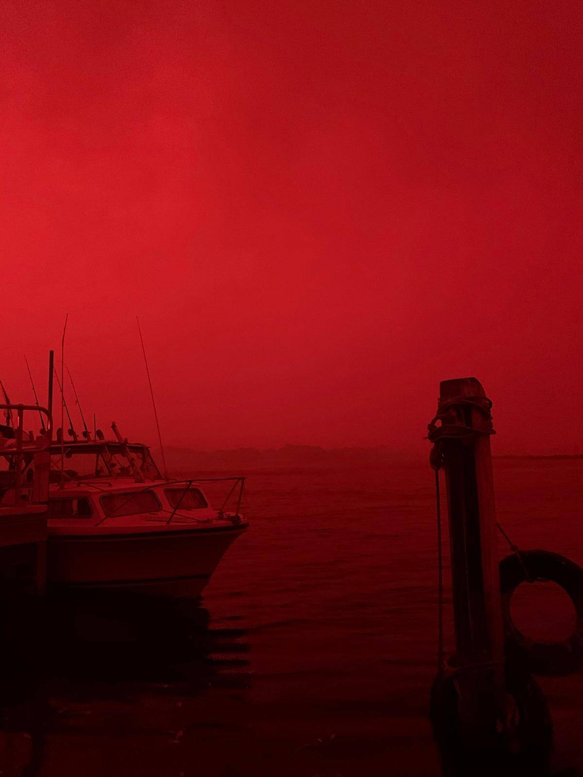 The sky glows red as bushfires continue to rage in Mallacoota, Victoria, Australia