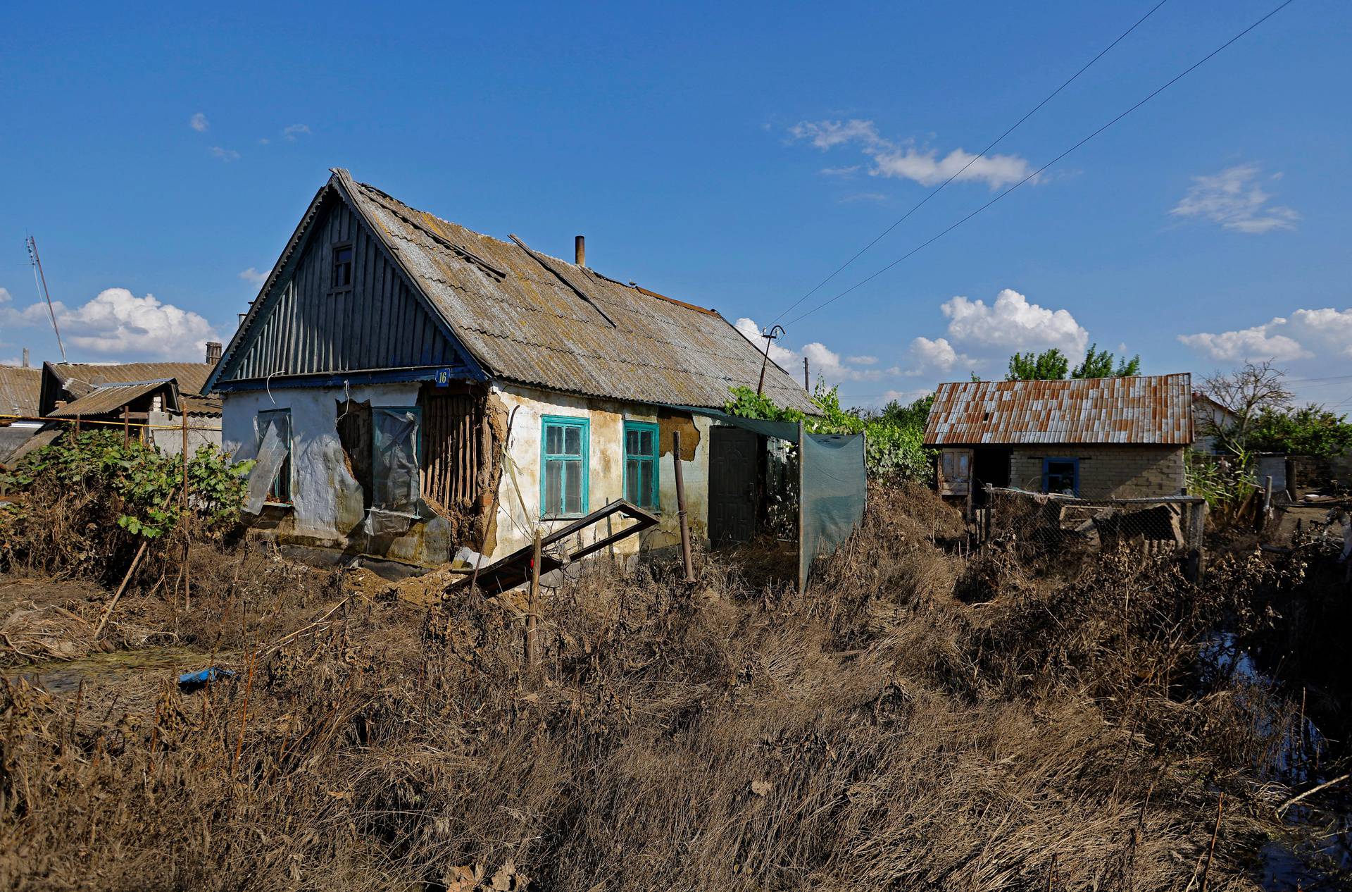 A view shows a damaged house after floodwaters receded in Hola Prystan