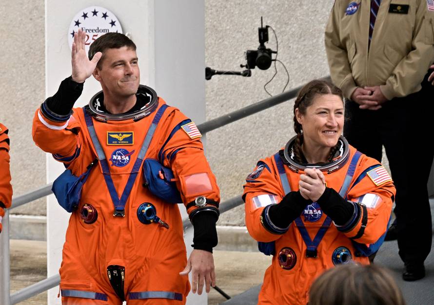 Artemis II NASA astronauts walk to board the astronaut van for their drive to launch pad 39B