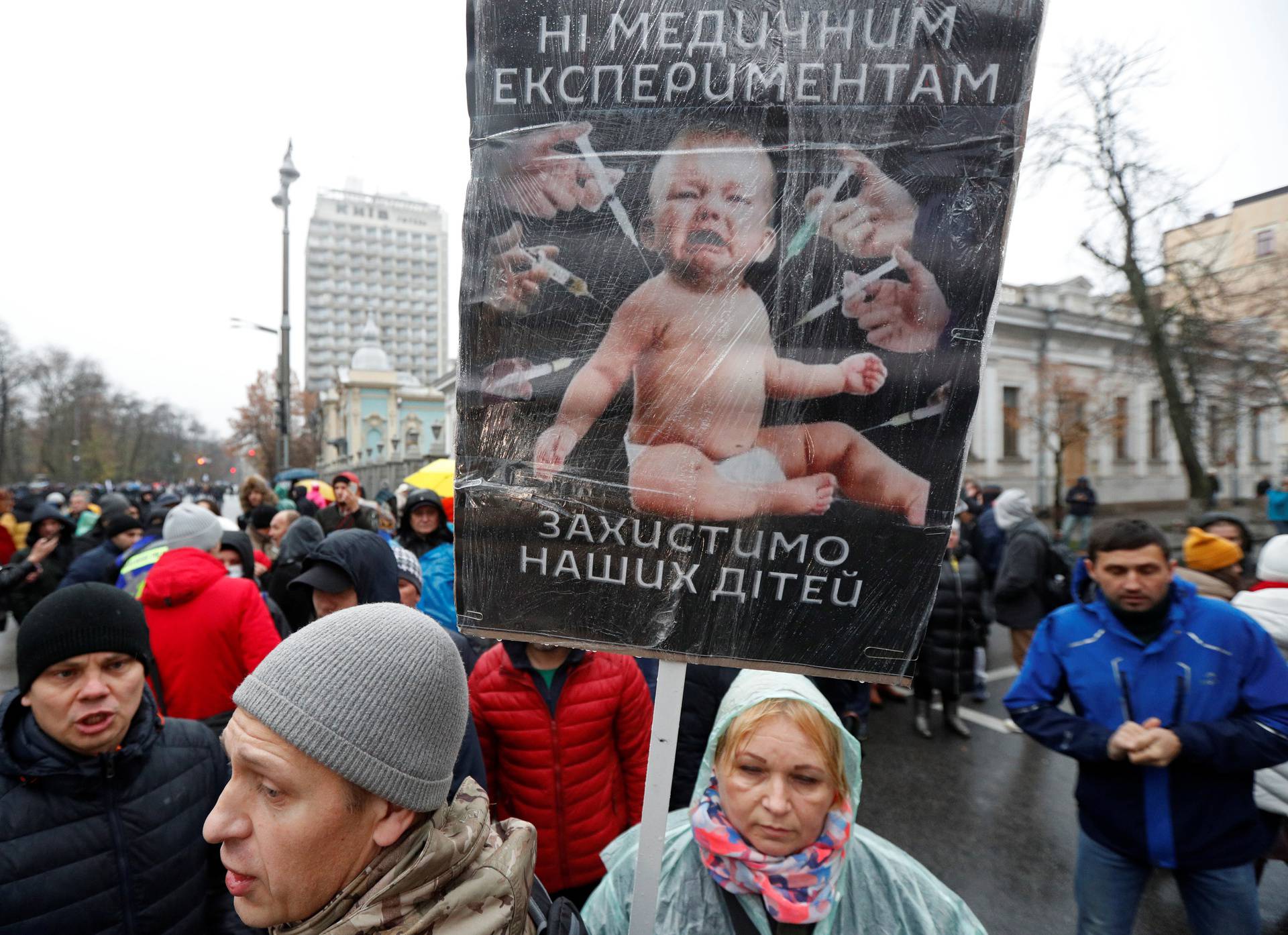 People attend a rally against coronavirus disease (COVID-19) restrictions in Kyiv