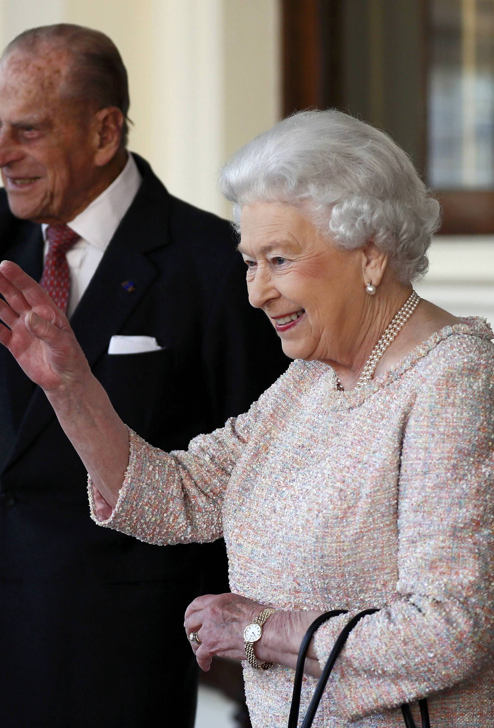 FILE  PHOTO : Britain's Queen Elizabeth and Prince Philip bid farewell to Colombia's President Juan Manuel Santos and his wife Maria Clemencia de Santos at Buckingham Palace in London