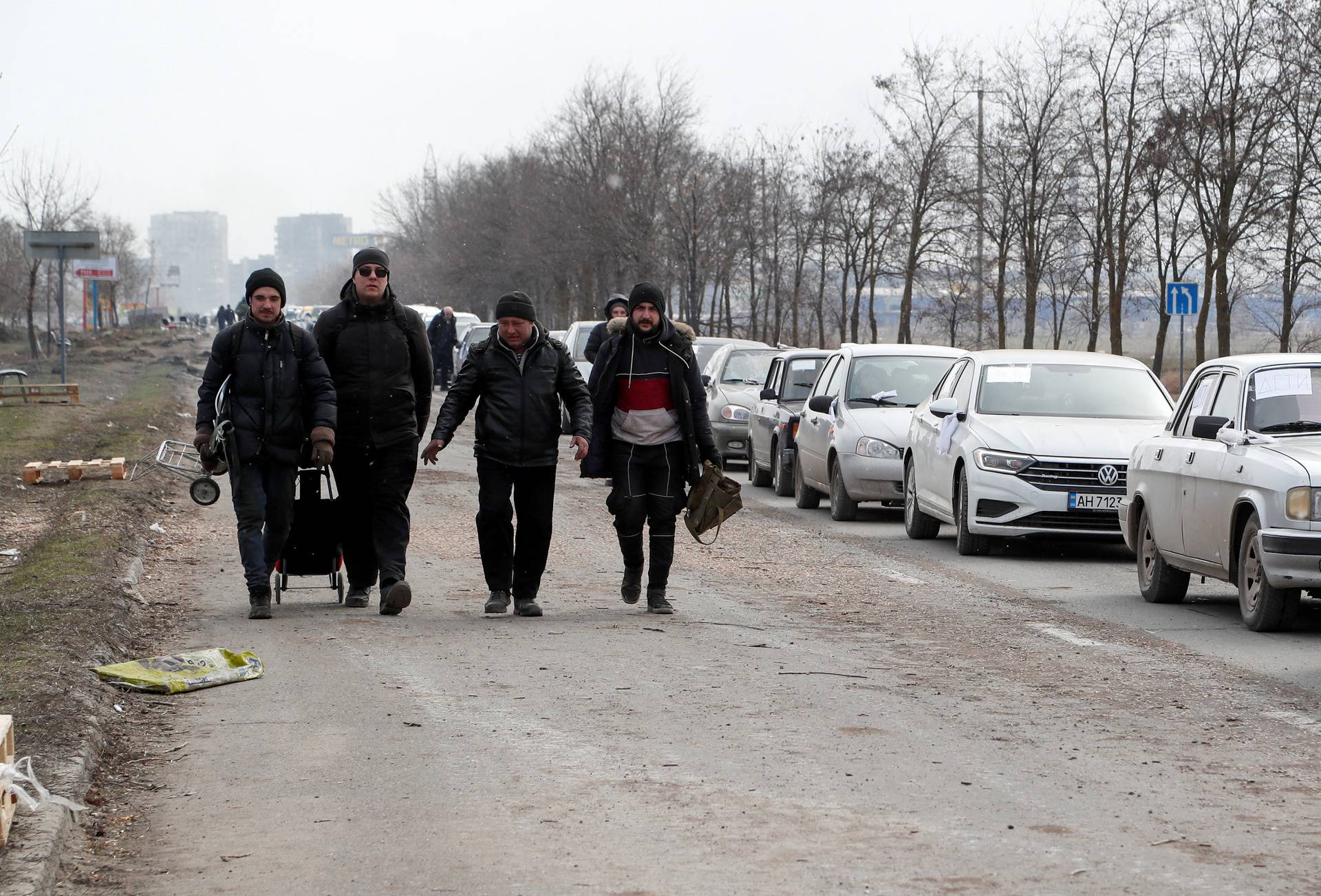 Evacuees leave the besieged city of Mariupol
