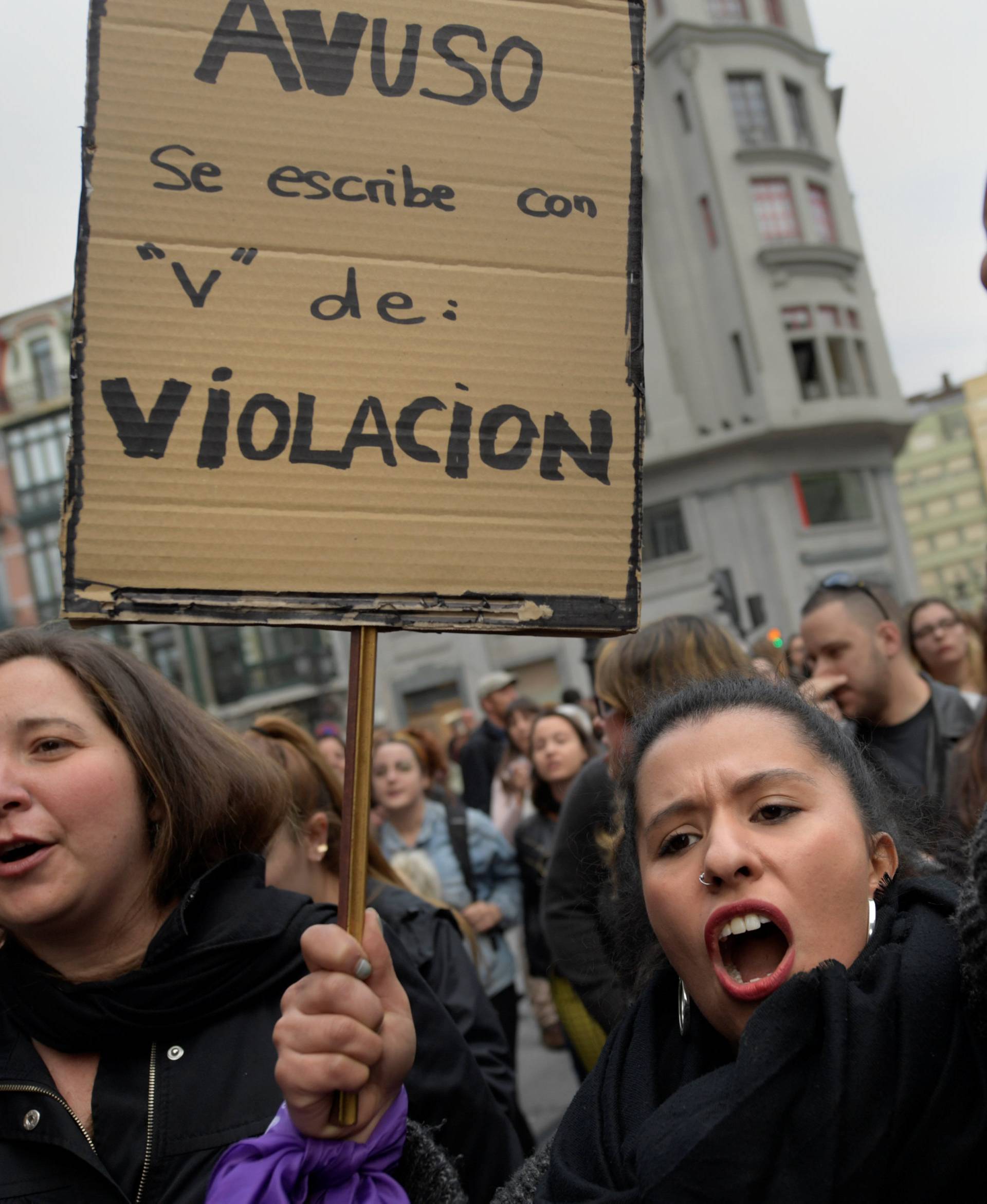 People shout slogans during a protest after a Spanish court condemned five men accused of the group rape of an 18-year-old woman in Oviedo