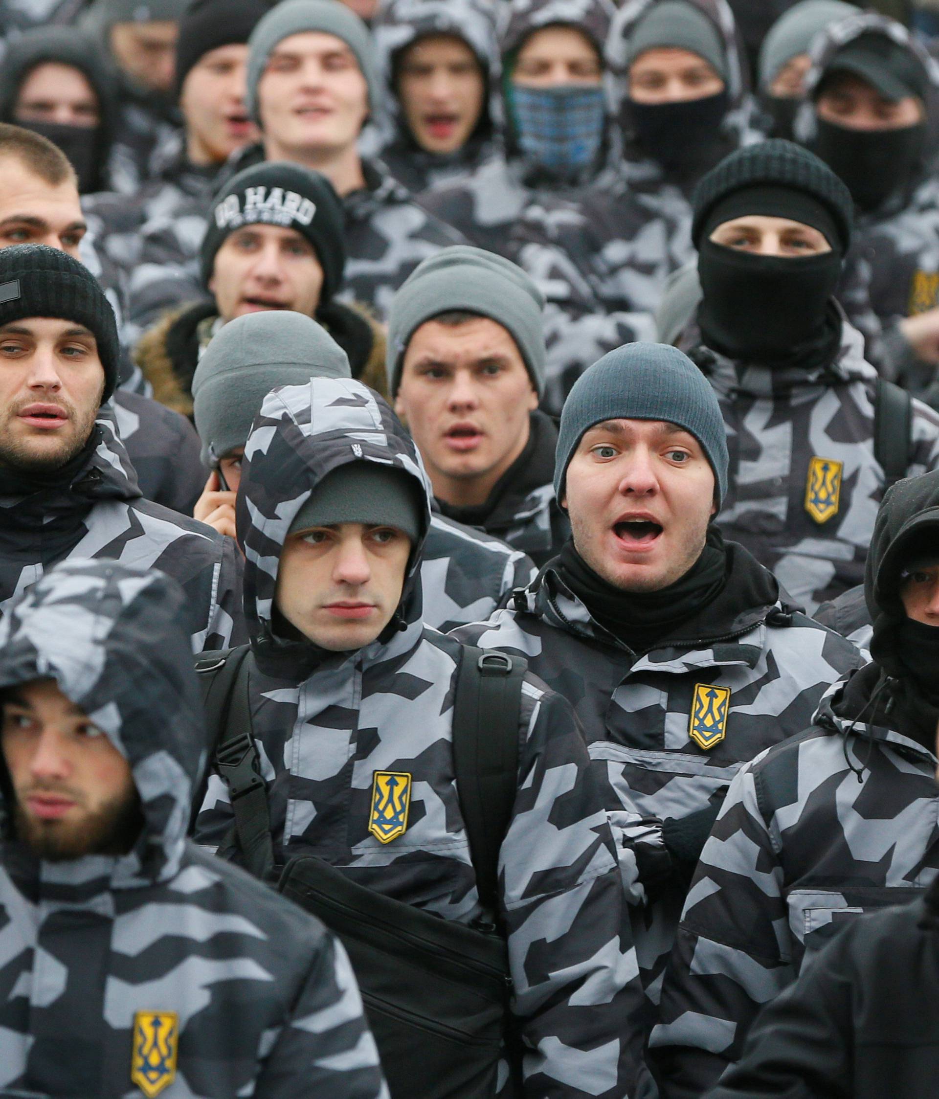 Activists of far-right parties attend a rally to support the Ukrainian navy after Russia seized two Ukrainian armored artillery vessels and a tug boat in the Black Sea on Sunday, in central Kiev