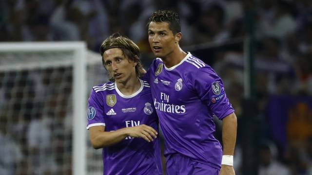 Real Madrid's Cristiano Ronaldo celebrates scoring their third goal with Luka Modric