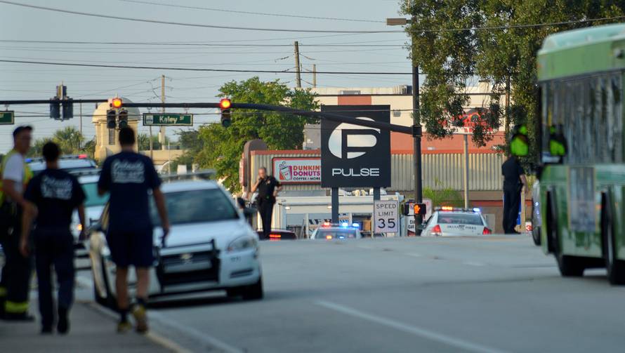 Police lock down Orange Avenue around Pulse nightclub, where people were killed by a gunman in a shooting rampage in Orlando