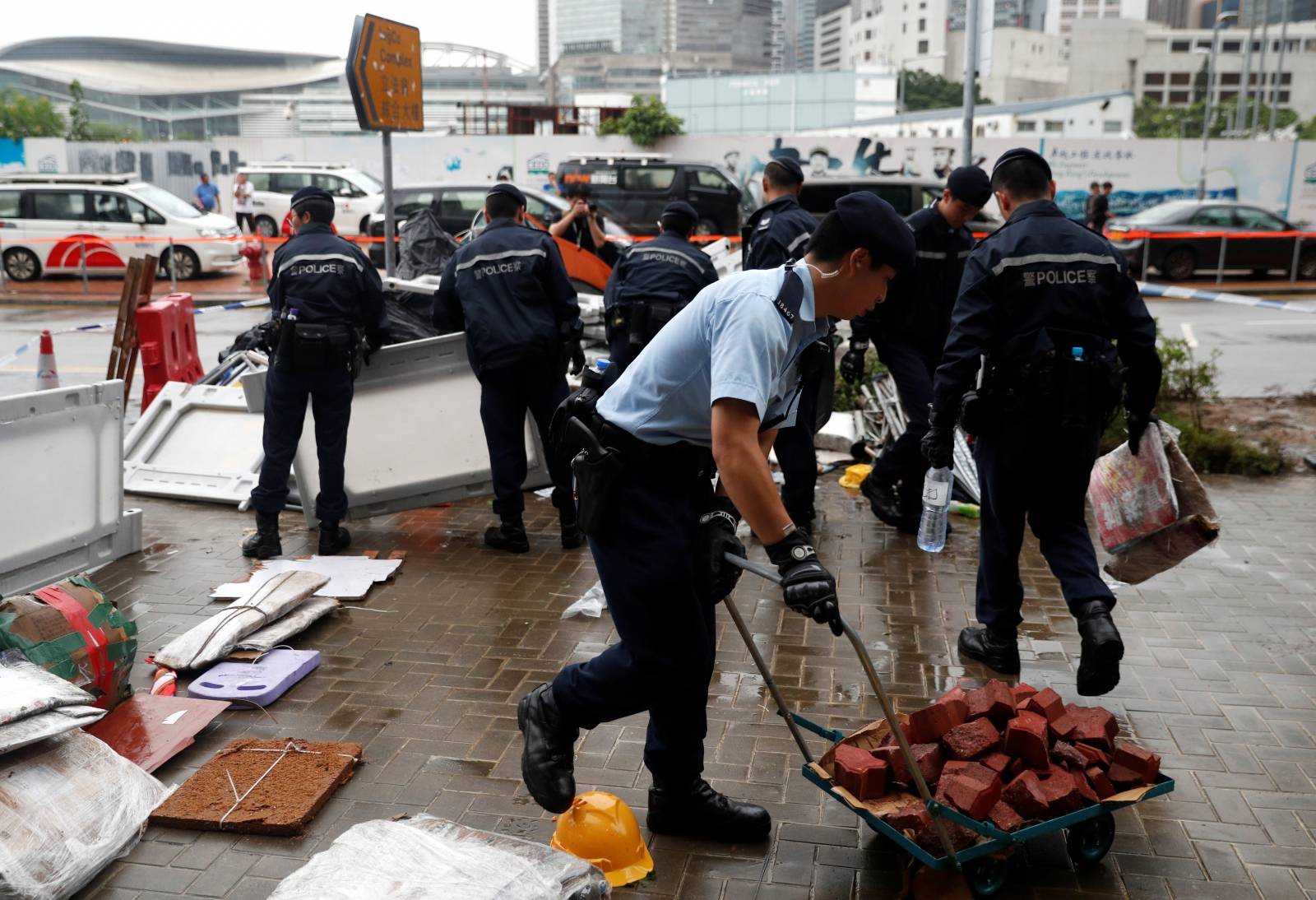 Police officers display objects used during a demonstration outside the Legislative complex in Hong Kong