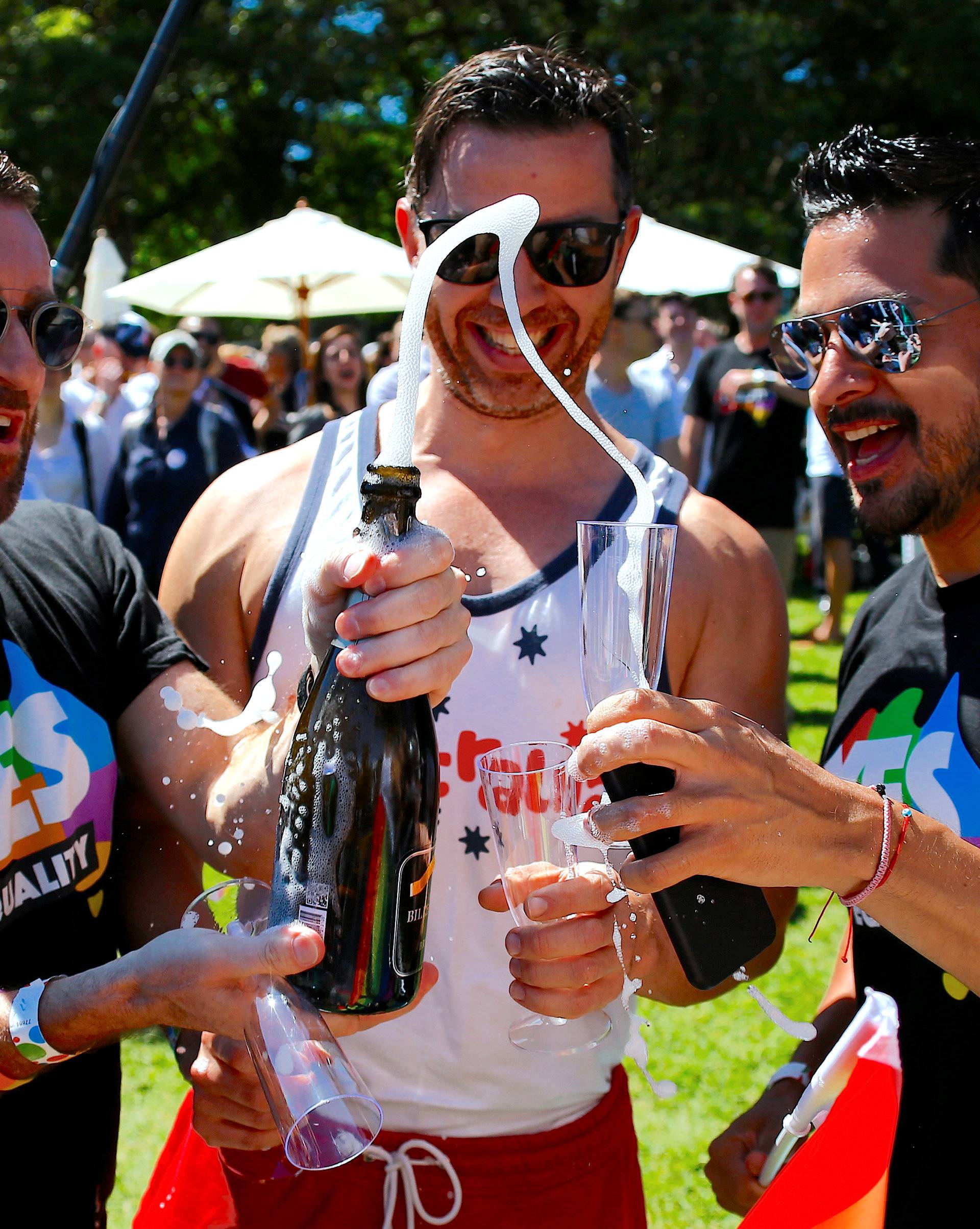 Supporters of the 'Yes' vote for marriage equality celebrate after it was announced the majority of Australians support same-sex marriage in a national survey, at a rally in Sydney