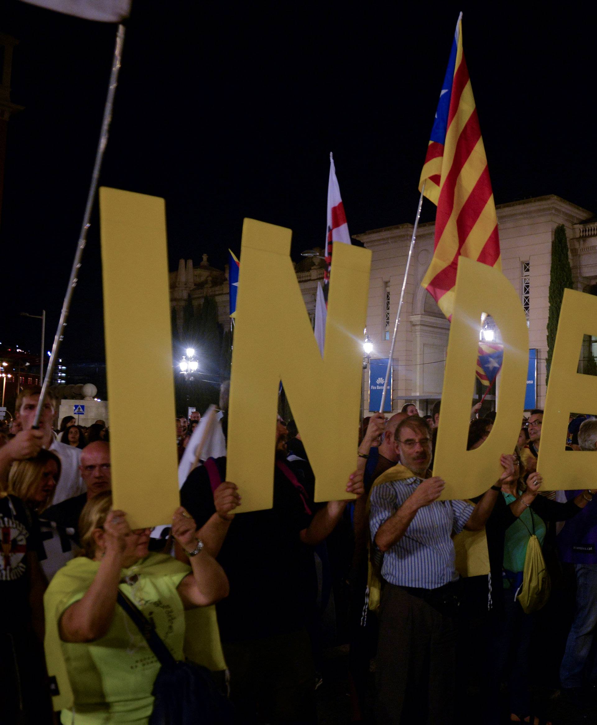 People hold letters to form the word "Independence" during a closing rally in favour of the banned October 1 independence referendum in Barcelona