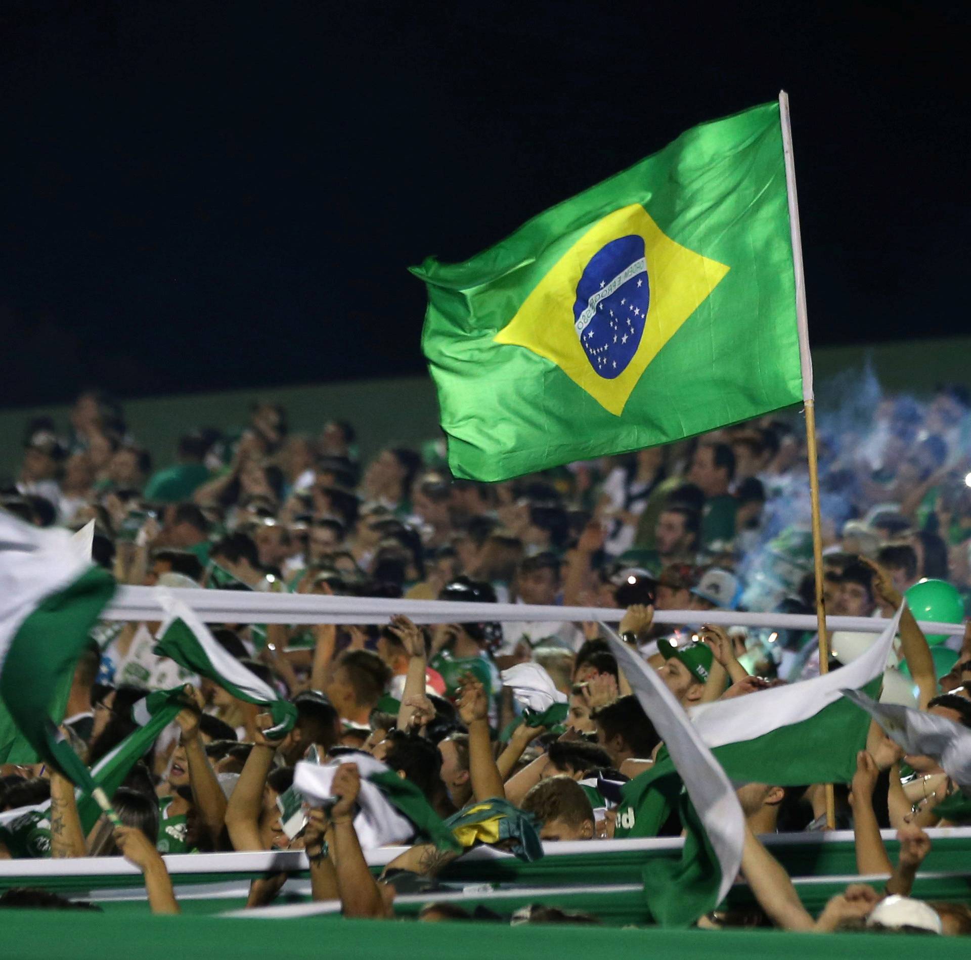 Fans of Chapecoense soccer team pay tribute to Chapecoense's players at the Arena Conda stadium in Chapeco