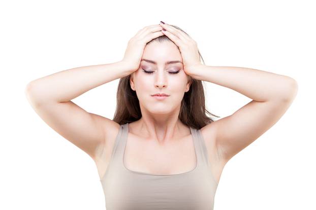 Beautiful young caucasian woman doing face yoga pose