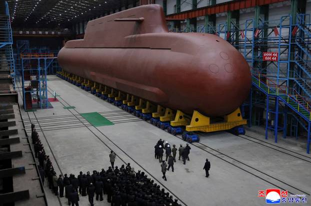 North Korean leader Kim Jong Un visits the construction site of an 8,700-ton nuclear-powered submarine