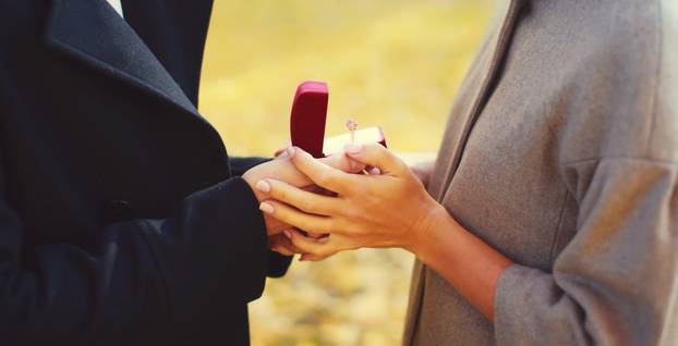 Love, relationships, engagement and wedding concept - man propos