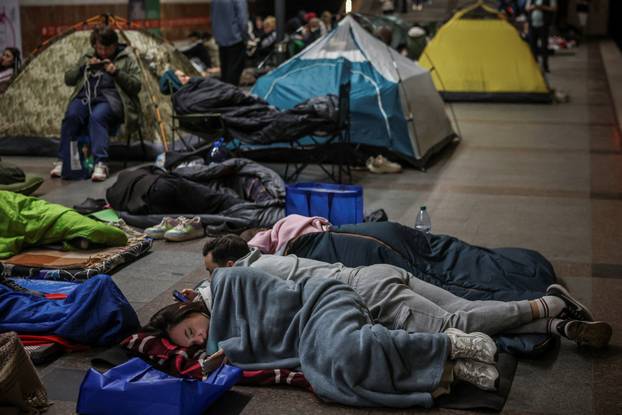 People take shelter during a Russian missile and drone strike, amid Russia's attack on Ukraine, in Kyiv