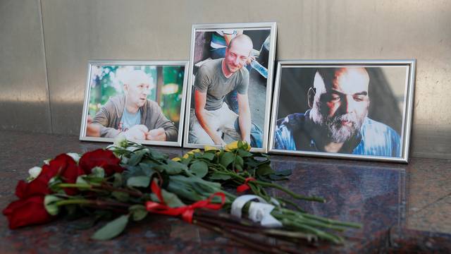 Photographs of journalists Dzhemal, Radchenko and Rastorguyev recently killed in Central African Republic are on display in Moscow