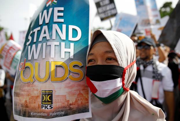 Protesters hold a rally outside the U.S. embassy in Jakarta, Indonesia, to condemn the U.S. decision to recognise Jerusalem as Israel