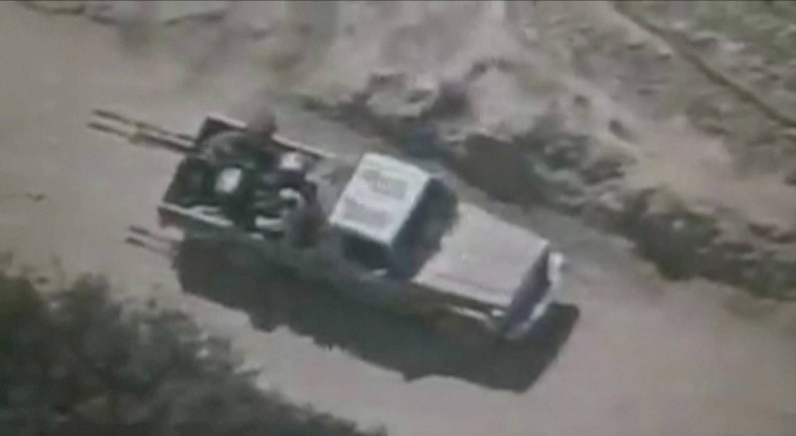 Video grab of people believed to be militants on a pickup truck with a gun in Afghanistan