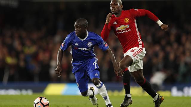 Manchester United's Paul Pogba in action with Chelsea's N'Golo Kante