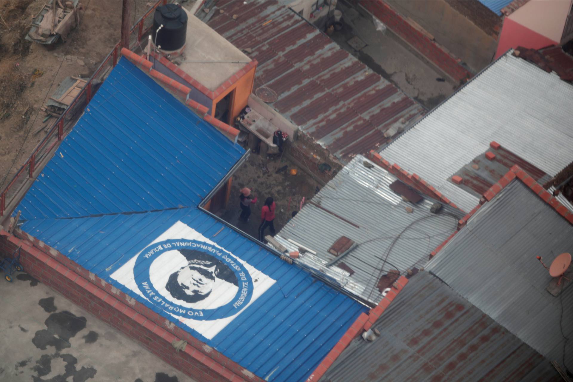 A graffiti depicting former Bolivia President Evo Morales is seen on the top of a house in La Paz