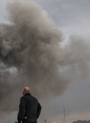 Smoke rises following an explosion, after Israel and the U.S. launched strikes on Iran, in Tehran