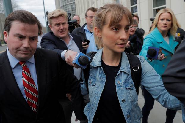 FILE PHOTO: Actress Allison Mack, known for her role in the TV series "Smallville", departs after being granted bail following being charged with sex trafficking and conspiracy in New York