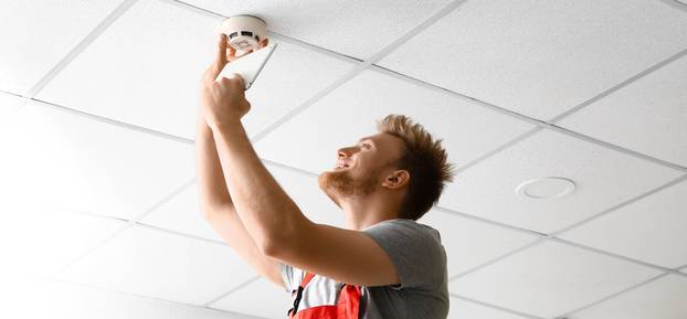 Technician,Installing,Smart,Home,Security,System,In,Room