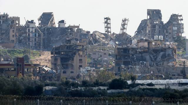 Damaged houses lie in ruin in northern Gaza