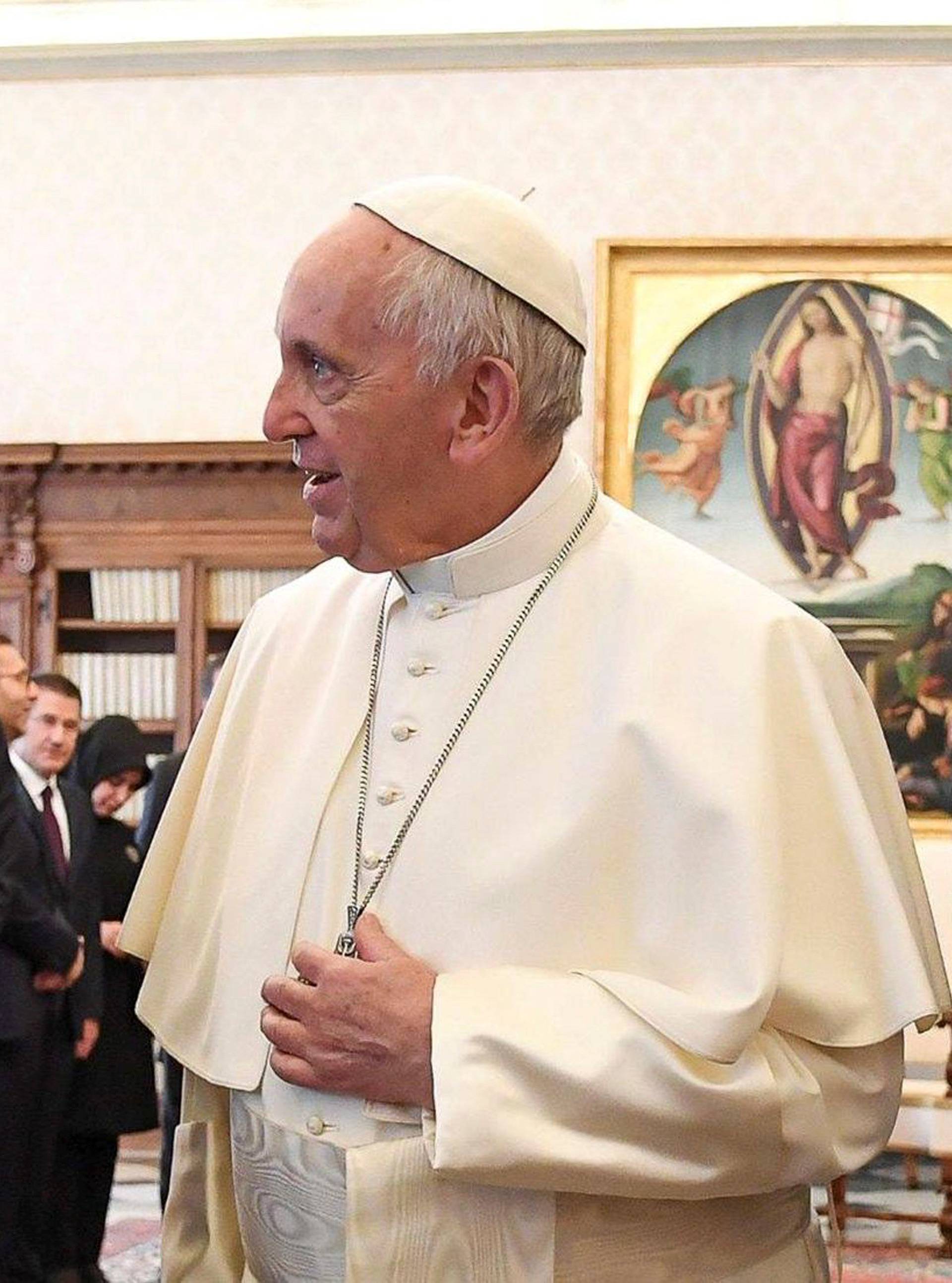 Pope Francis talks with Turkish President Tayyip Erdogan during a private audience at the Vatican