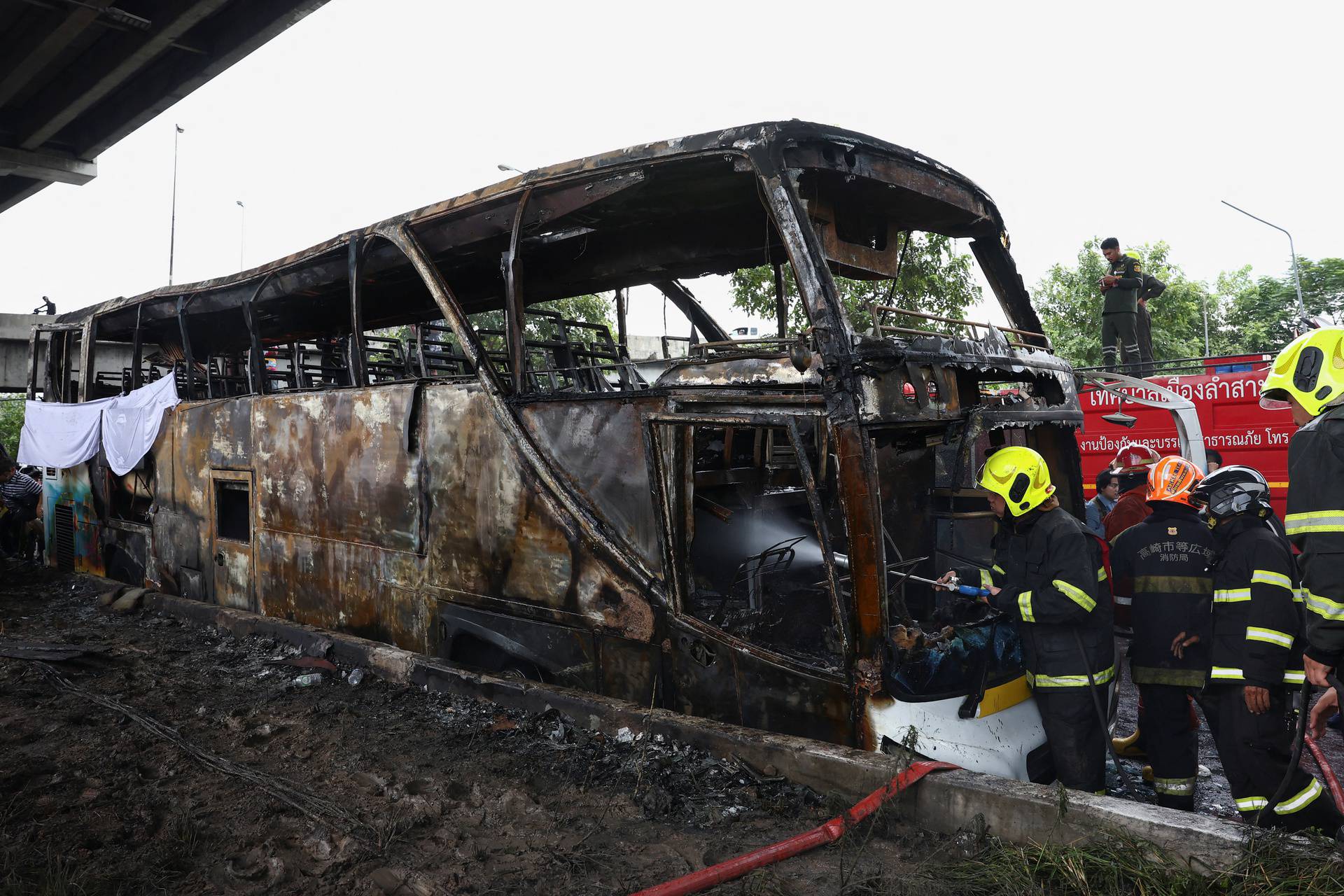 Rescue efforts after bus burns carrying teachers and students on outskirts of Bangkok