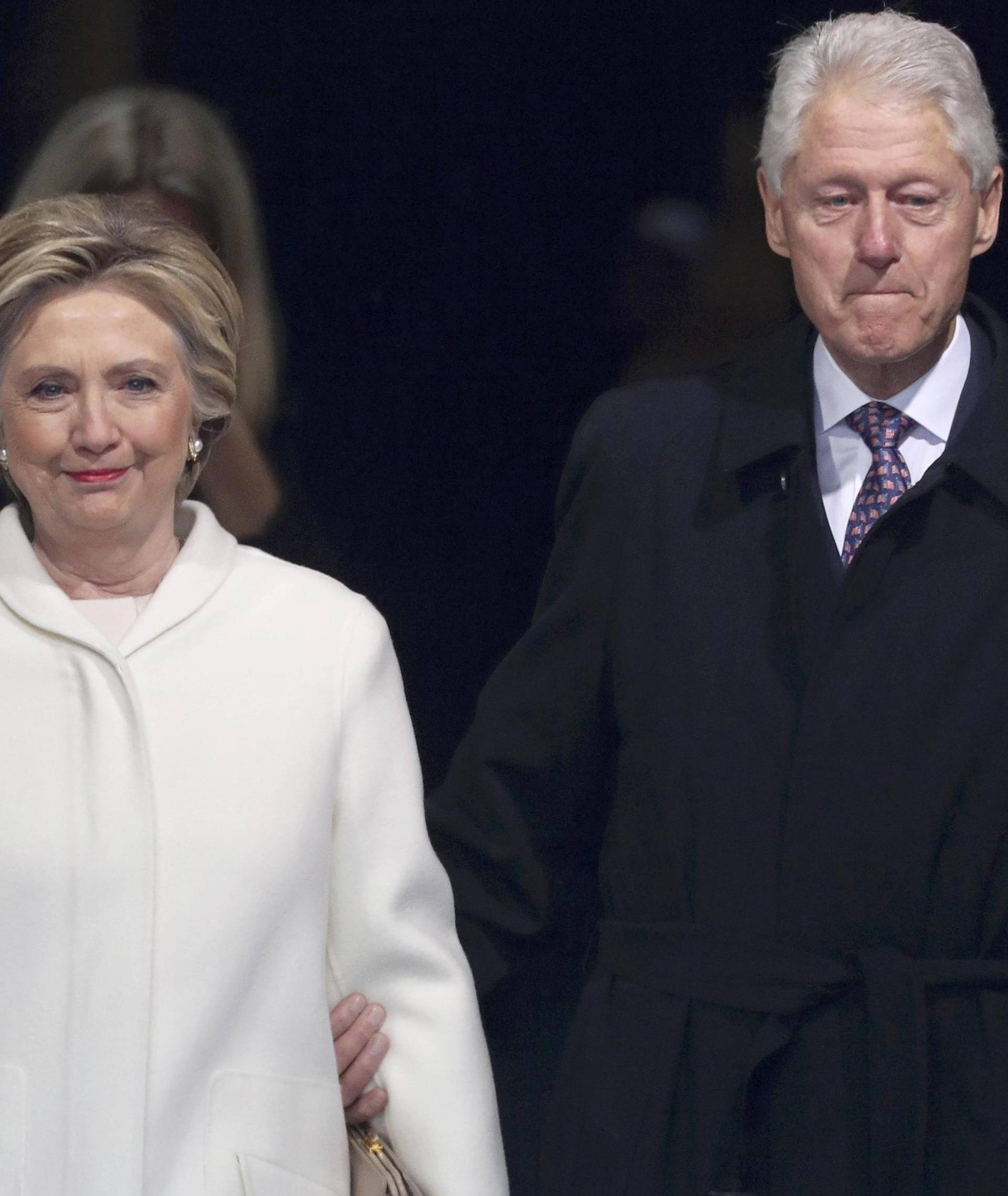 Former president Bill Clinton and former Democratic presidential candidate Hillary Clinton arrive at inauguration ceremonies swearing in Donald Trump as the 45th president of the United States on the West front of the U.S. Capitol in Washington