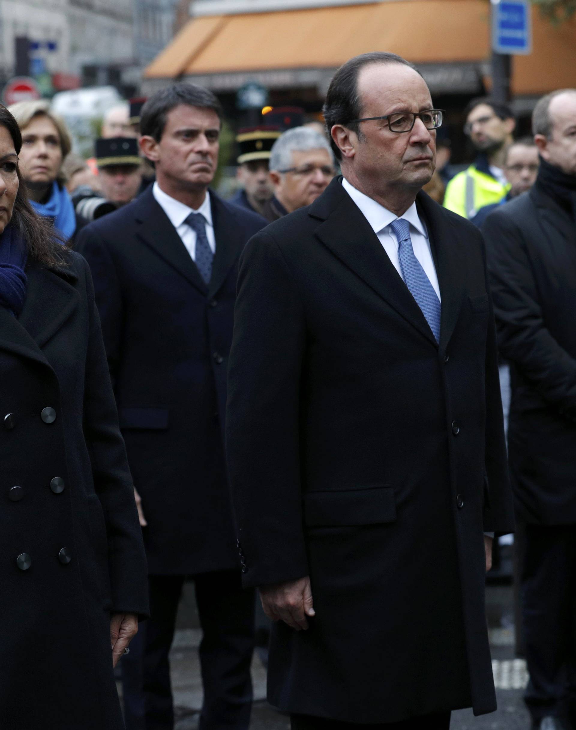 French President Francois Hollande and Paris Mayor Anne Hidalgo unveil a commemorative plaque next to the "A La Bonne Biere" cafe