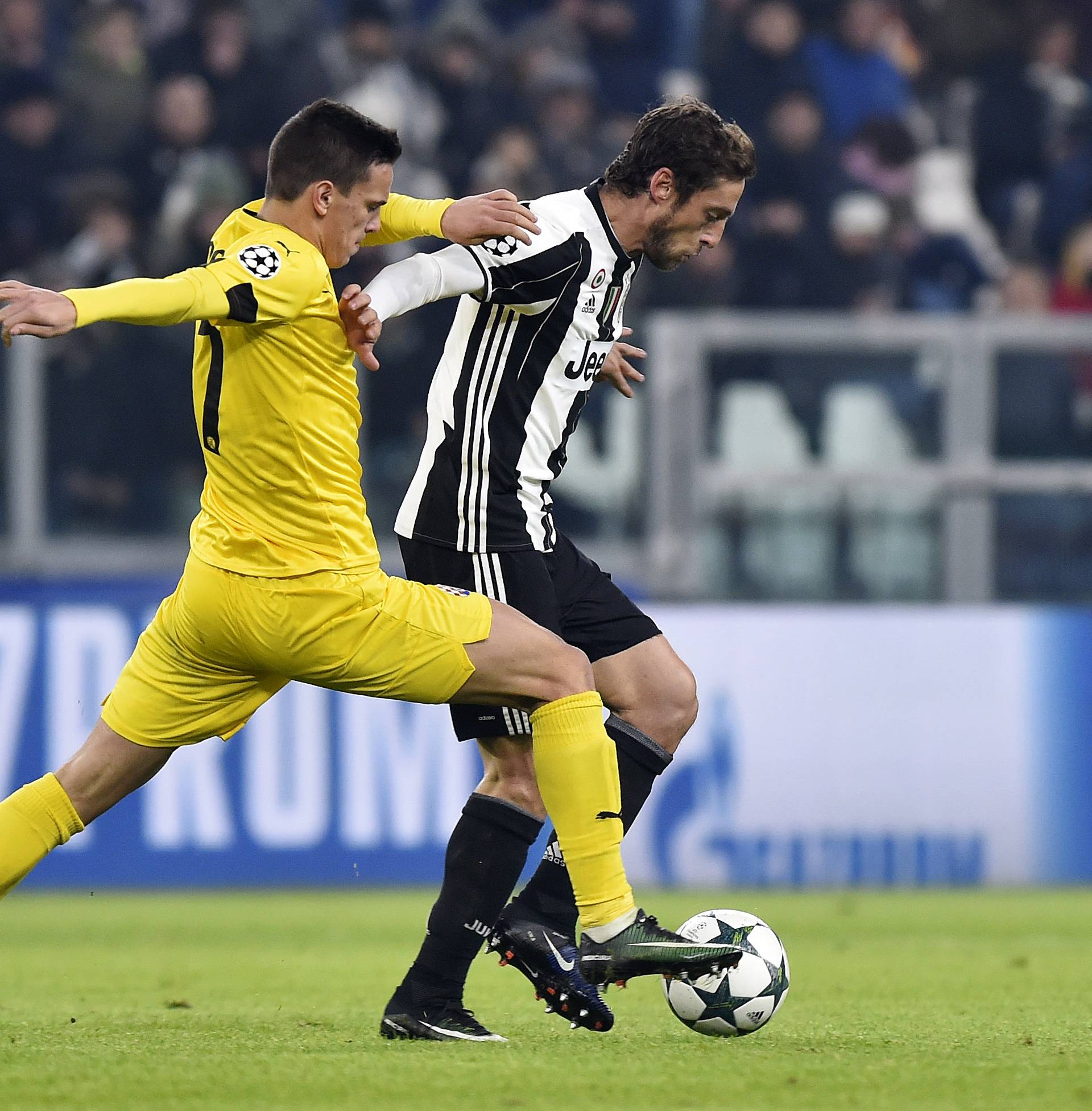 Dinamo Zagreb's Mario Situm in action with Juventus' Claudio Marchisio
