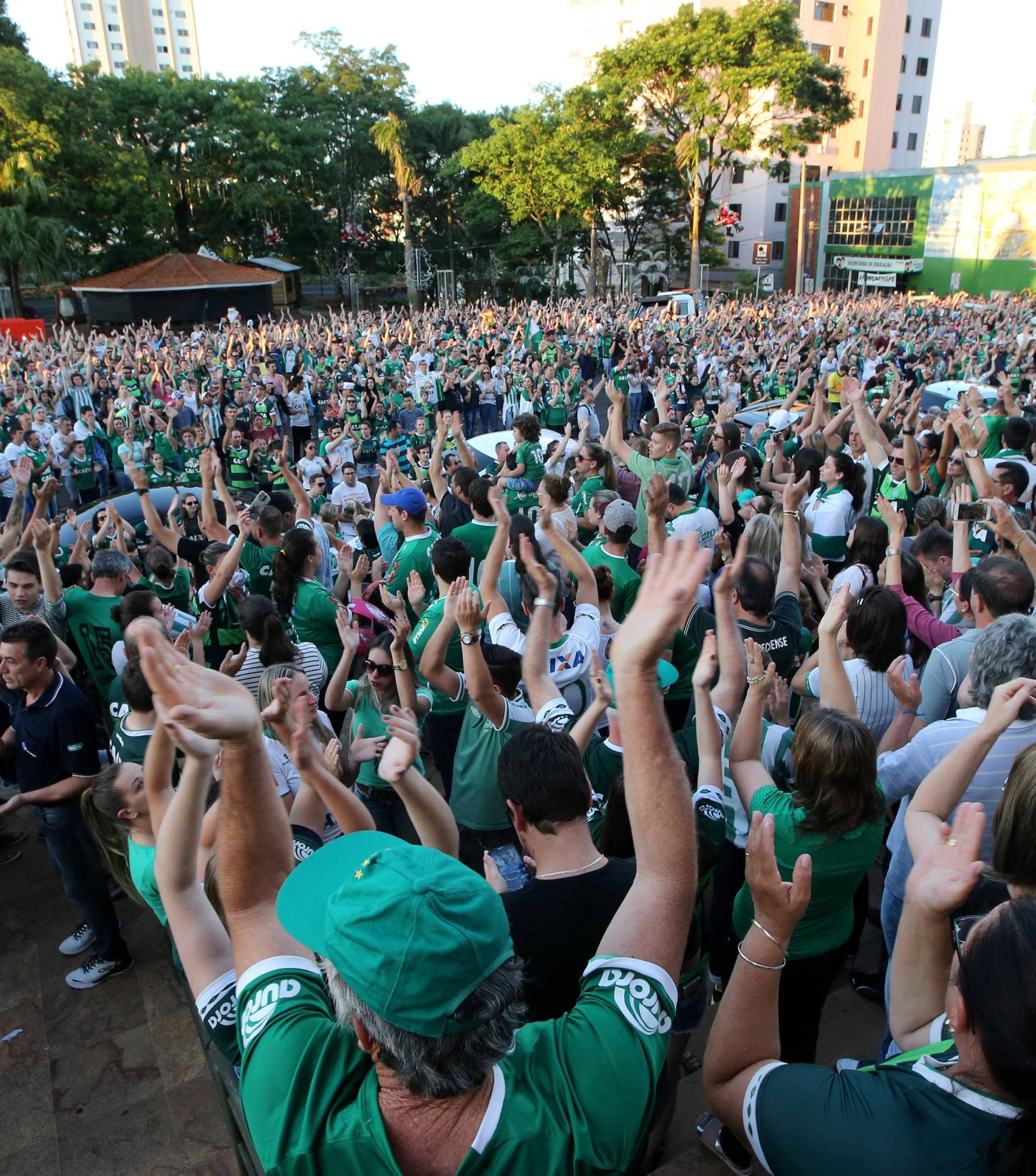 Fans of Chapecoense soccer team gather in the streets to pay tribute to their players in Chapeco