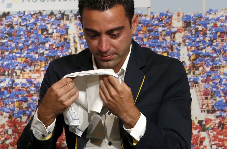 FILE PHOTO: Barcelona's Xavi Hernandez cries during his farewell event at Auditori 1899 in Nou Camp stadium in Barcelona