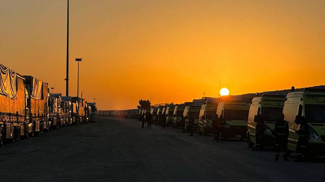 Ambulances and aid trucks waiting to enter Gaza strip from the side of Rafah